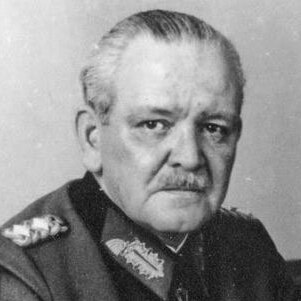 A black and white photo of a man in a German WWII uniform.