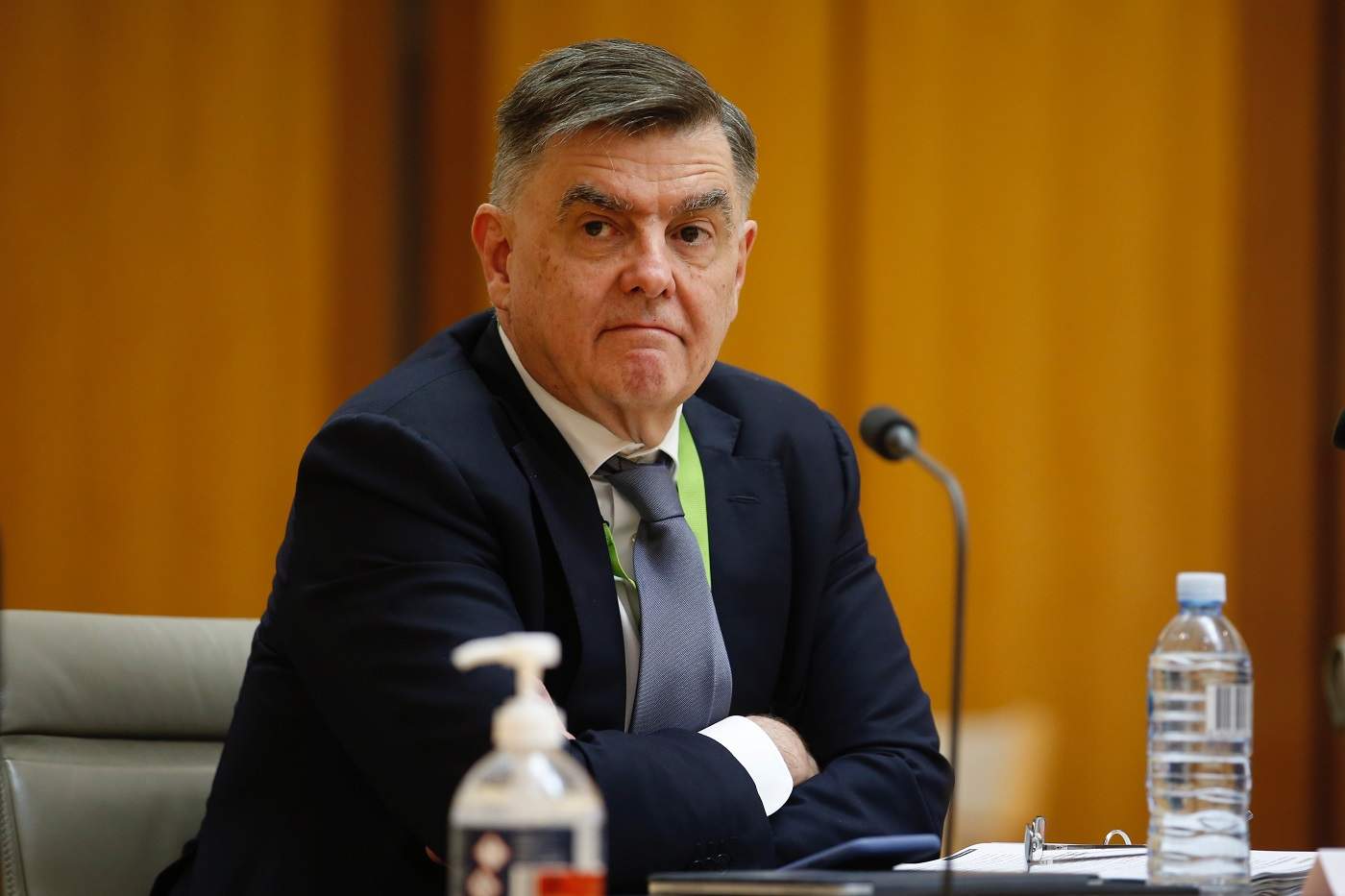 Brendan Murphy sits at a long table.