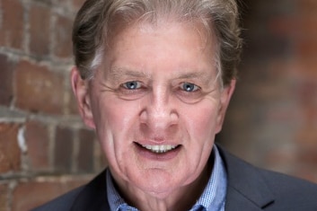 a portrait photo of Garry Fielding wearing a blue shirt and blazer