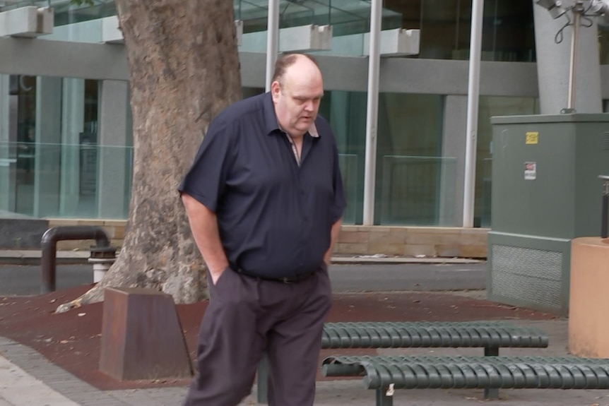 A man walking into court 