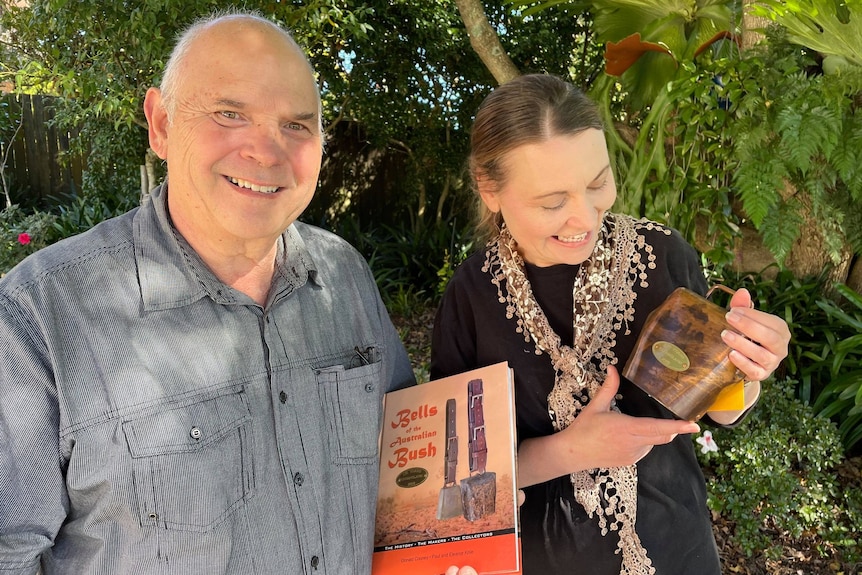 A couple with a cowbell and book.