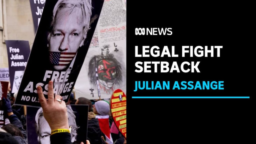 Legal Fight Setback, Julian Assange: Placards advocating for Julian Assange's freedom are held up at a rally.