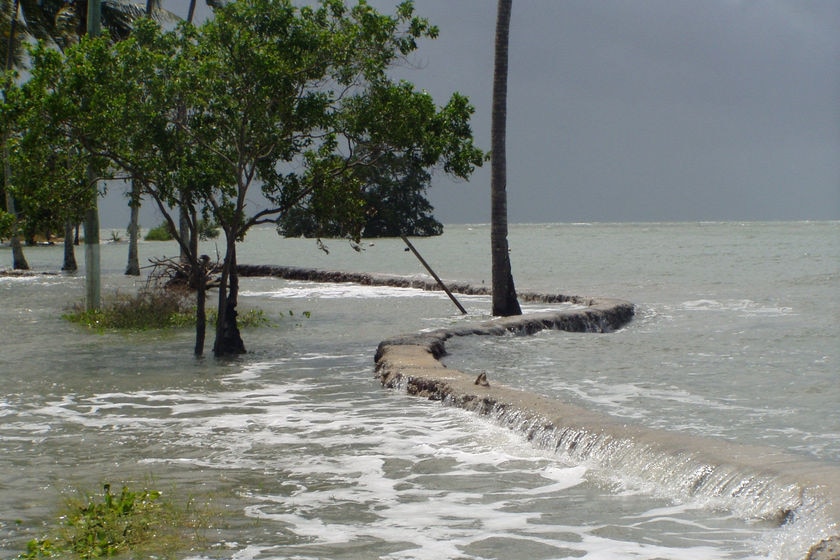 A king tide breaches a sea wall on Saibai Island in January 2009.
