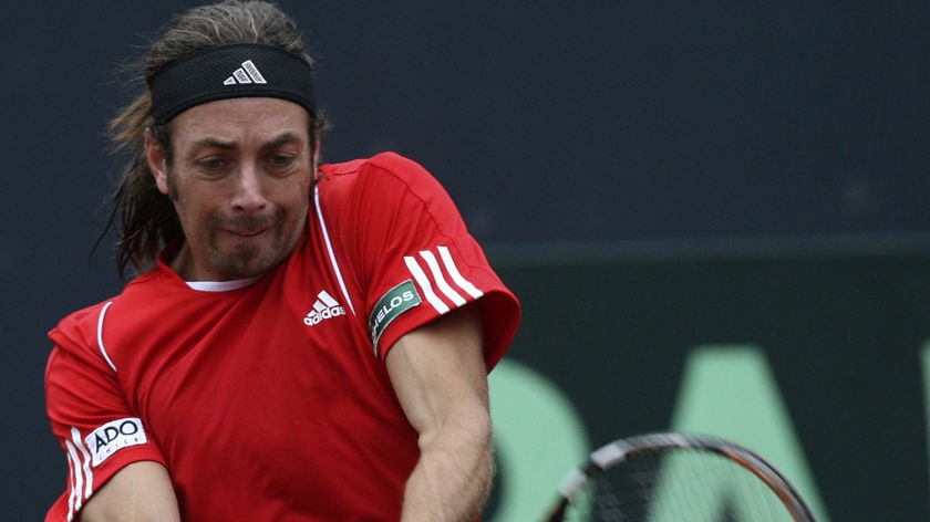 Nicolas Massu returns the ball