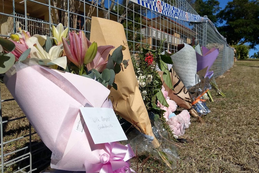 Floral tributes outside Karen Gilliland's home in The Range in Rockhampton.