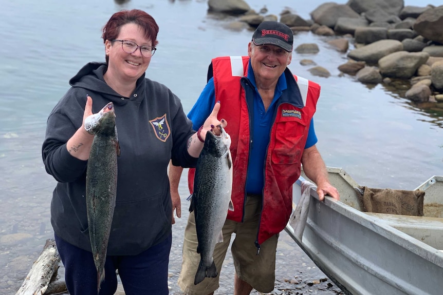 Rebecca and Geoffrey Bryan with fish they caught.