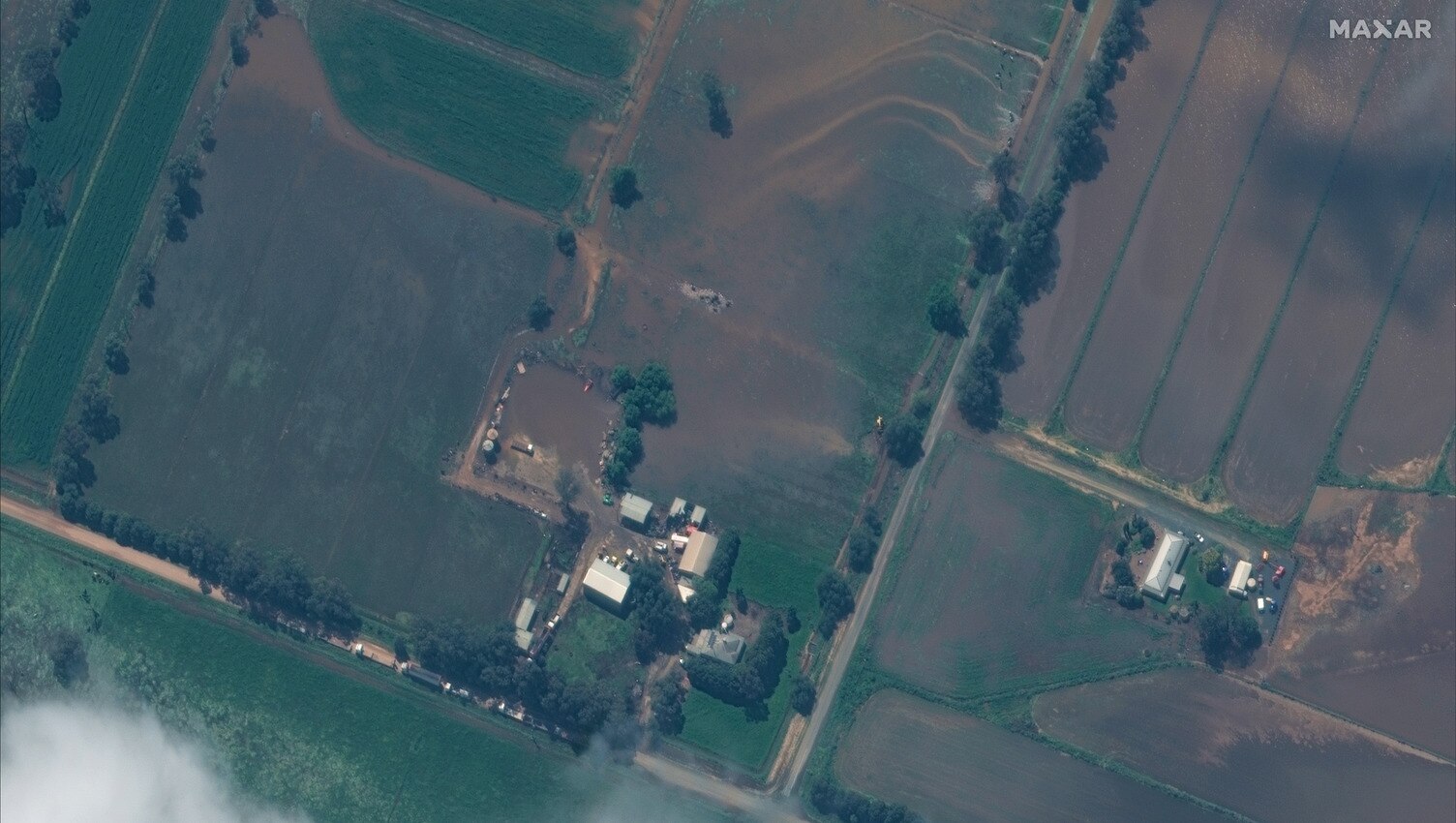 A picture of a farm from the sky showing paddocks and buildings