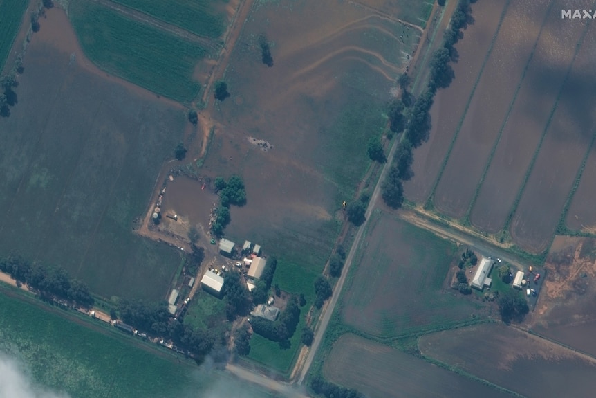 A picture of a farm from the sky showing paddocks and buildings