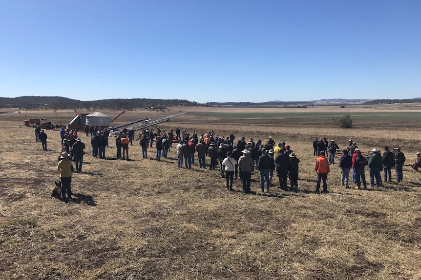 Neighbours gather at a clearing sale at the McCreath's old property in Felton, Queensland, in December 2018.