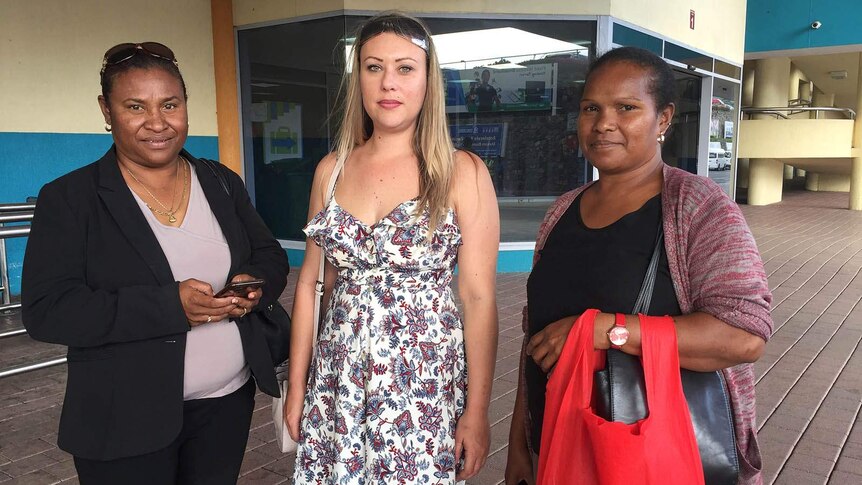 Three women outside Port Moresby Airport