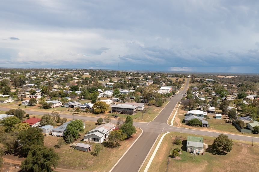 Aerial photo looking down a street in Taroom with storm clouds in the distance, Queensland November 2021.