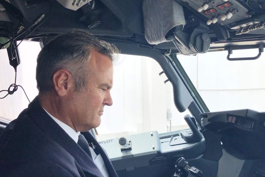 A man inside a plane's cockpit