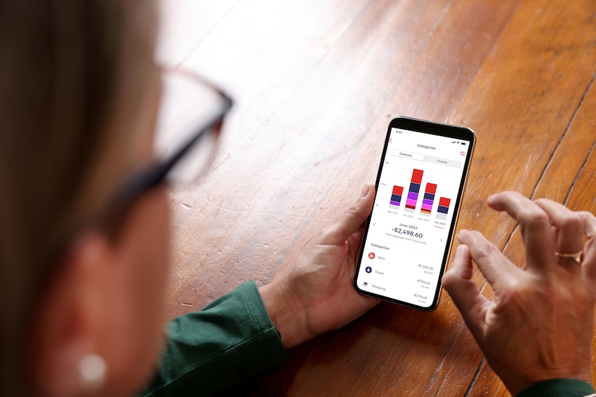 Customer uses Westpac's spending tracker app on their mobile phone