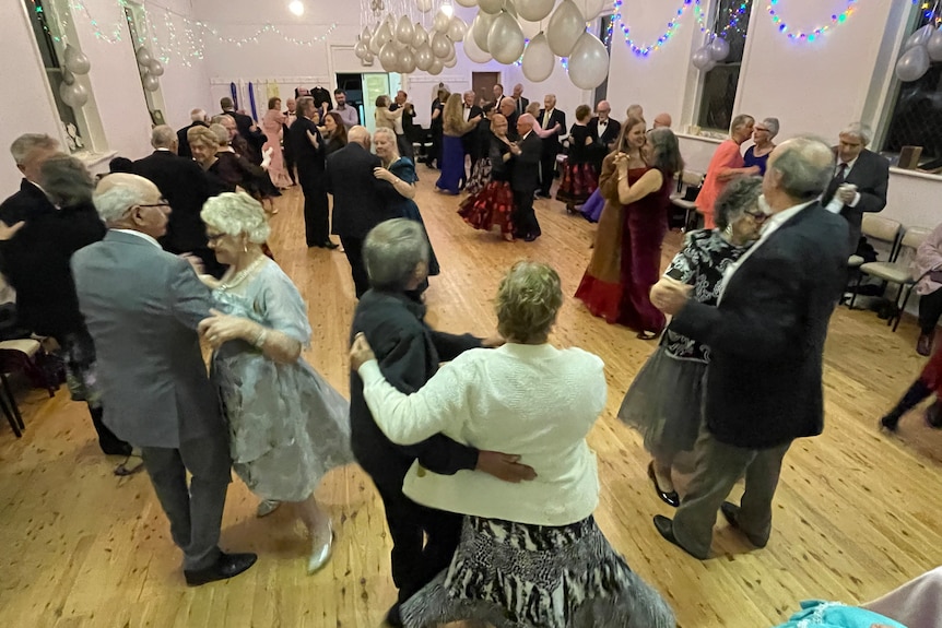 Photo of people dancing in a hall.