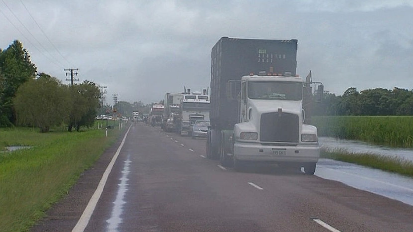 TV still of trucks queued on Bruce Highway due to flooding in north Qld on January 13, 2009.