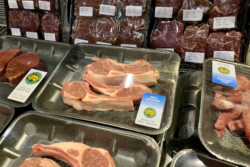 Trays of different cuts of meat.