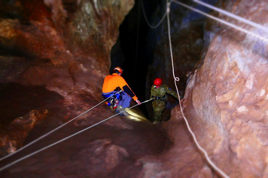 A trainer and recruit spelunking.