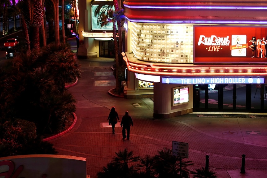 Two people walking in the deserted streets of Las Vegas