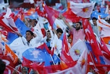 Supporters of ruling AK Party wave Turkish and party flags as they listen to Prime Minister Ahmet Davutoglu (not pictured) during an election rally for Turkey's June 7 parliamentary election, in Gaziantep, Turkey, June 5, 2015