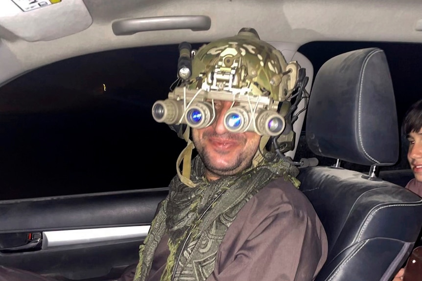 Mohammad Khalid Wardak wears night goggles after being rescued by the US military.