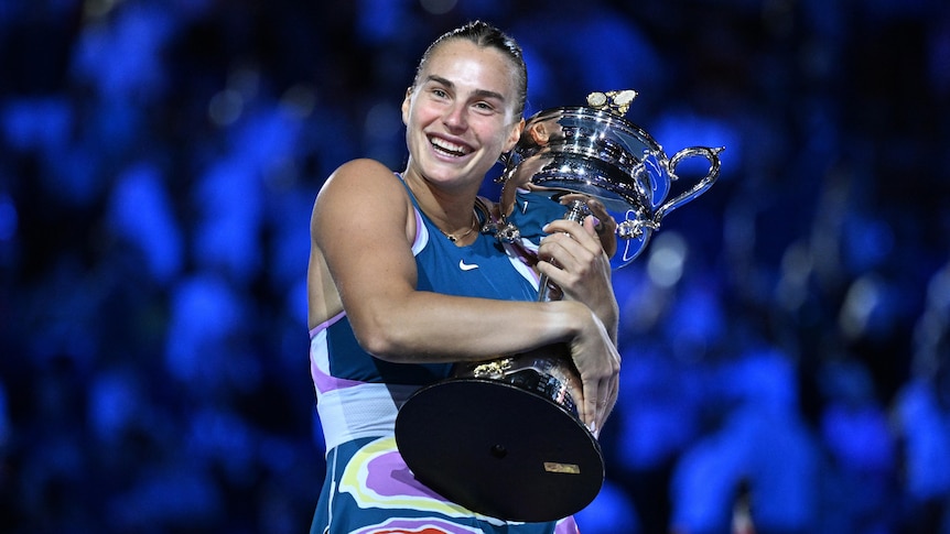 Aryna Sabalenka holds the Australian Open trophy.