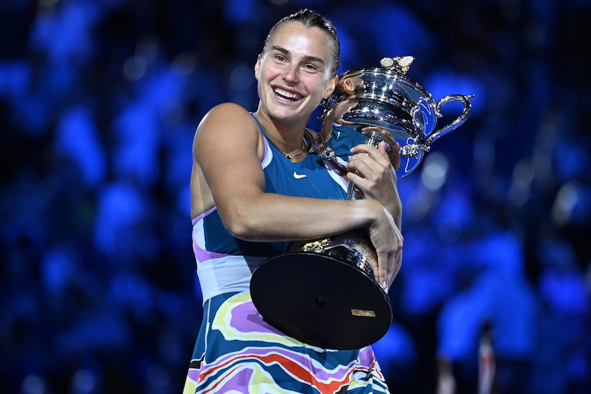 Aryna Sabalenka holds the Australian Open trophy.