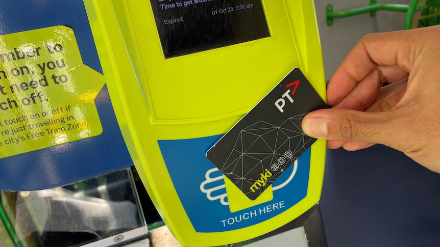 A grey card with the PTV and myki symbols is placed against a card reader which says the card has expired.