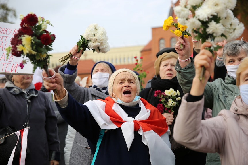 Women with flowers protesting 