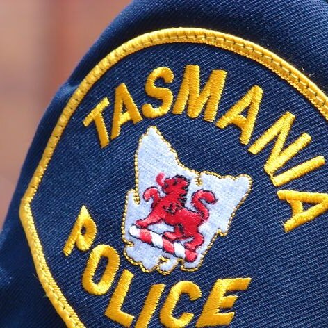 picture of the Tasmanian Police badge on the uniform of a police jacket