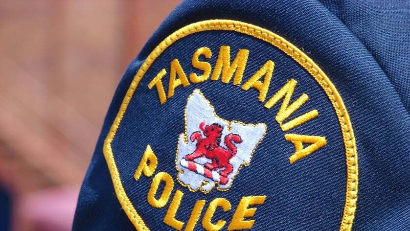 picture of the Tasmanian Police badge on the uniform of a police jacket