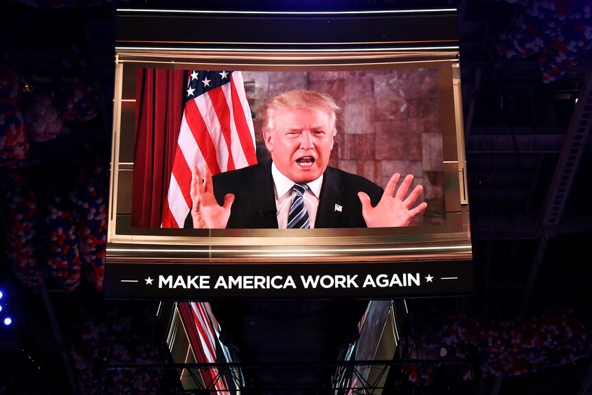Donald Trump speaks on screen during the second day of the Republican National Convention.