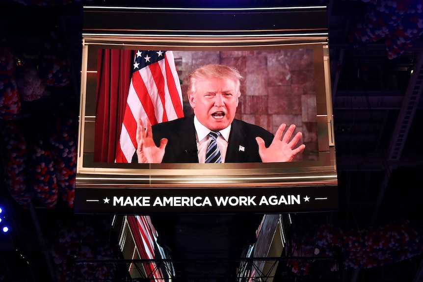 Donald Trump speaks on screen during the second day of the Republican National Convention.