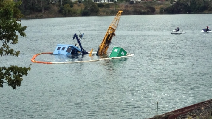 A partially submerged barge caused a pollution alert on the Leven River