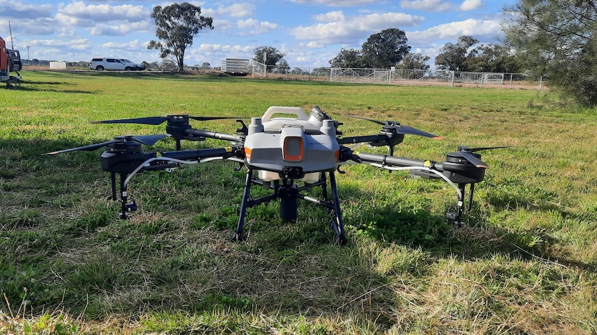 A drone sits in a field at the Agricultural Research Centre in Trangie.
