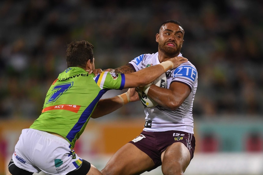 Dylan Walker tries to break free from a tackle against Canberra