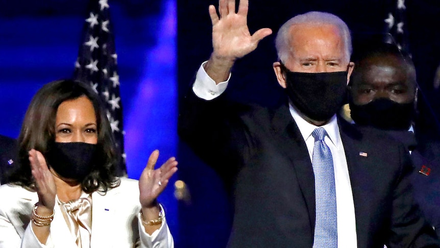 Kamala Harris and Joe Biden celebrating on stage their victory in the US Presidential Elections