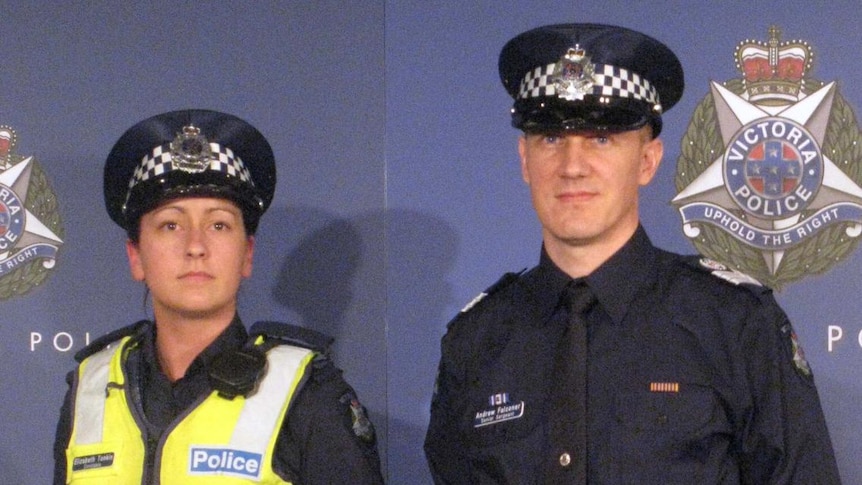 Two officers model the new uniforms for Victoria Police.