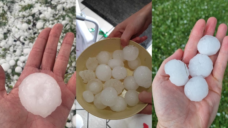 people holding large hail balls