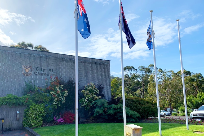 Four flagpoles outside Clarence Council Chambers in Bellerive, Tasmania