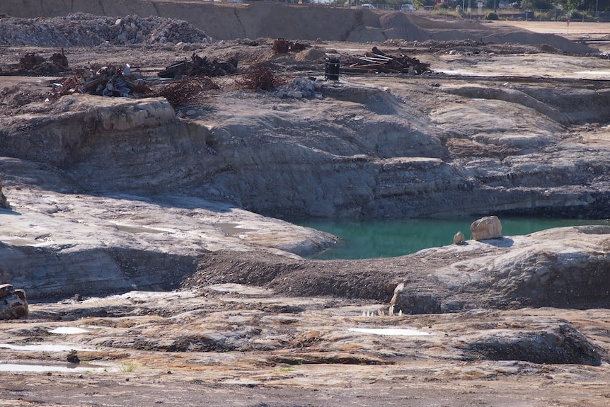 blue water in the centre of the Pasminco Smelter site in Boolaroo, that is being remediated.