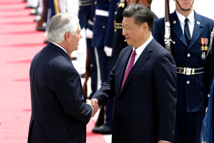 US Secretary of State Rex Tillerson shakes hands with Chinese president Xi Jinping