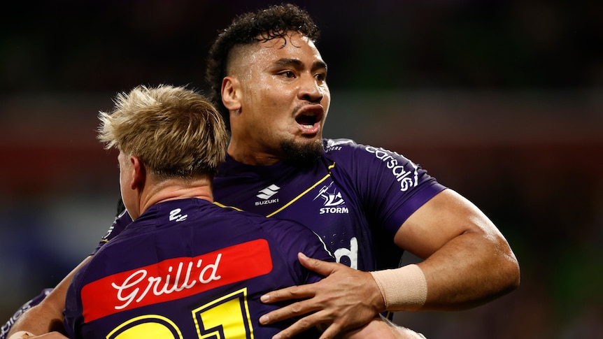 A man celebrates after scoring a try in a rugby league match