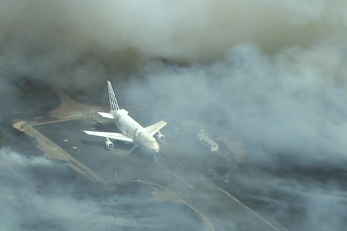 A plane surrounded by bushfire smoke.
