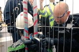 Police remove chains around activist