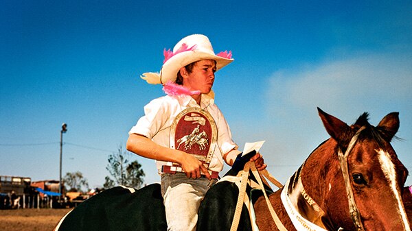 A young boy on a horse on a Northern Territory cattle station.