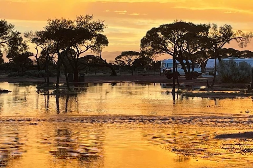 A large body of water at sunset.