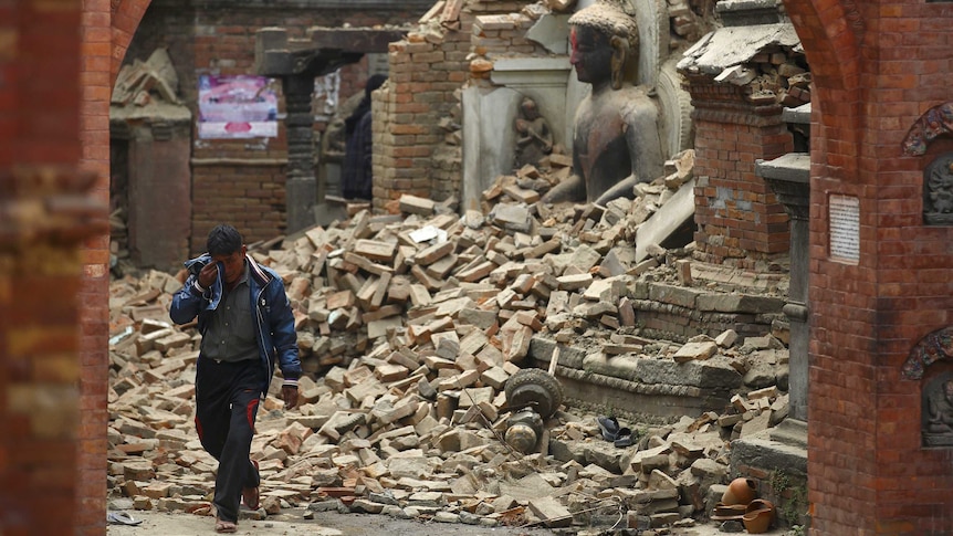 A man cries amid the rubble of Kathmandu