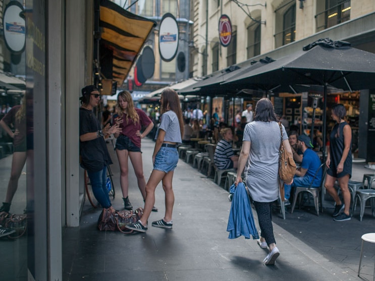 Young people hang around Degraves Street in Melbourne