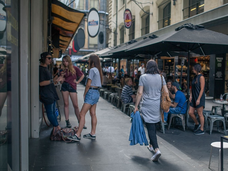 Young people hang around Degraves Street in Melbourne.