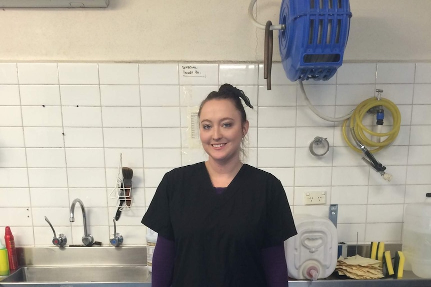 Amy Sagar faced discrimination in the funeral industry because of her youth. She's pictured here during her embalming course before putting on her personal protective equipment.